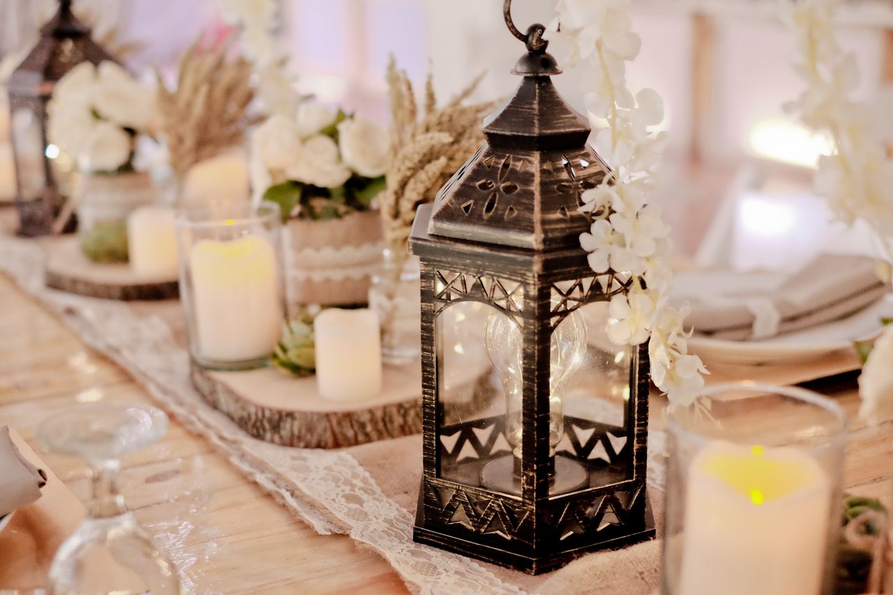 Elegant rustic table decor with lantern and candles